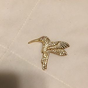Gold hummingbird brooch